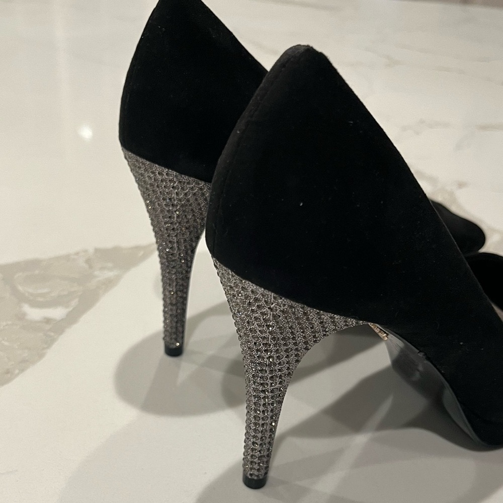 Black, stone-studded heels by Nina.